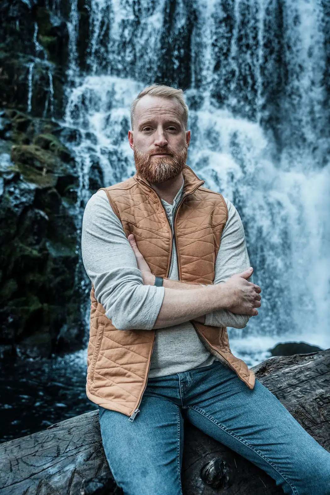 Roger Jæger at the foot of a waterfall